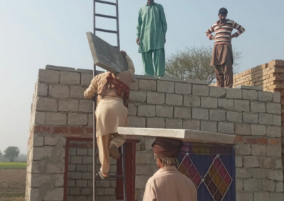 Volunteers building a home in rural village